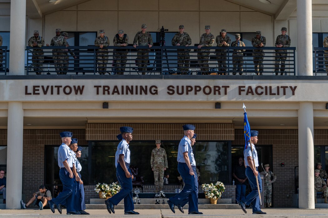U.S. Airmen assigned to the 336th Training Squadron march in front of the Levitow Training Support Facility during the 3rd quarter drill down at Keesler Air Force Base, Mississippi, Aug. 18, 2023.