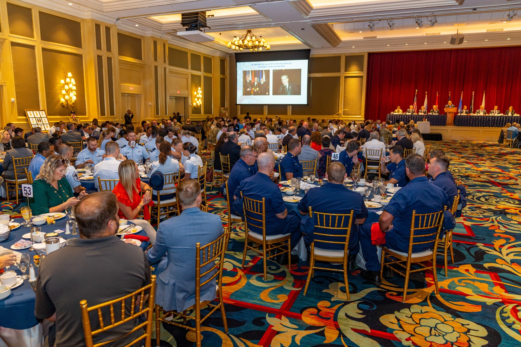 U.S. Airmen, Coast Guardsmen and civilians attend the 42nd Annual Salute to the Military at the Beau Rivage Resort and Casino, Mississippi, Aug. 29, 2023.