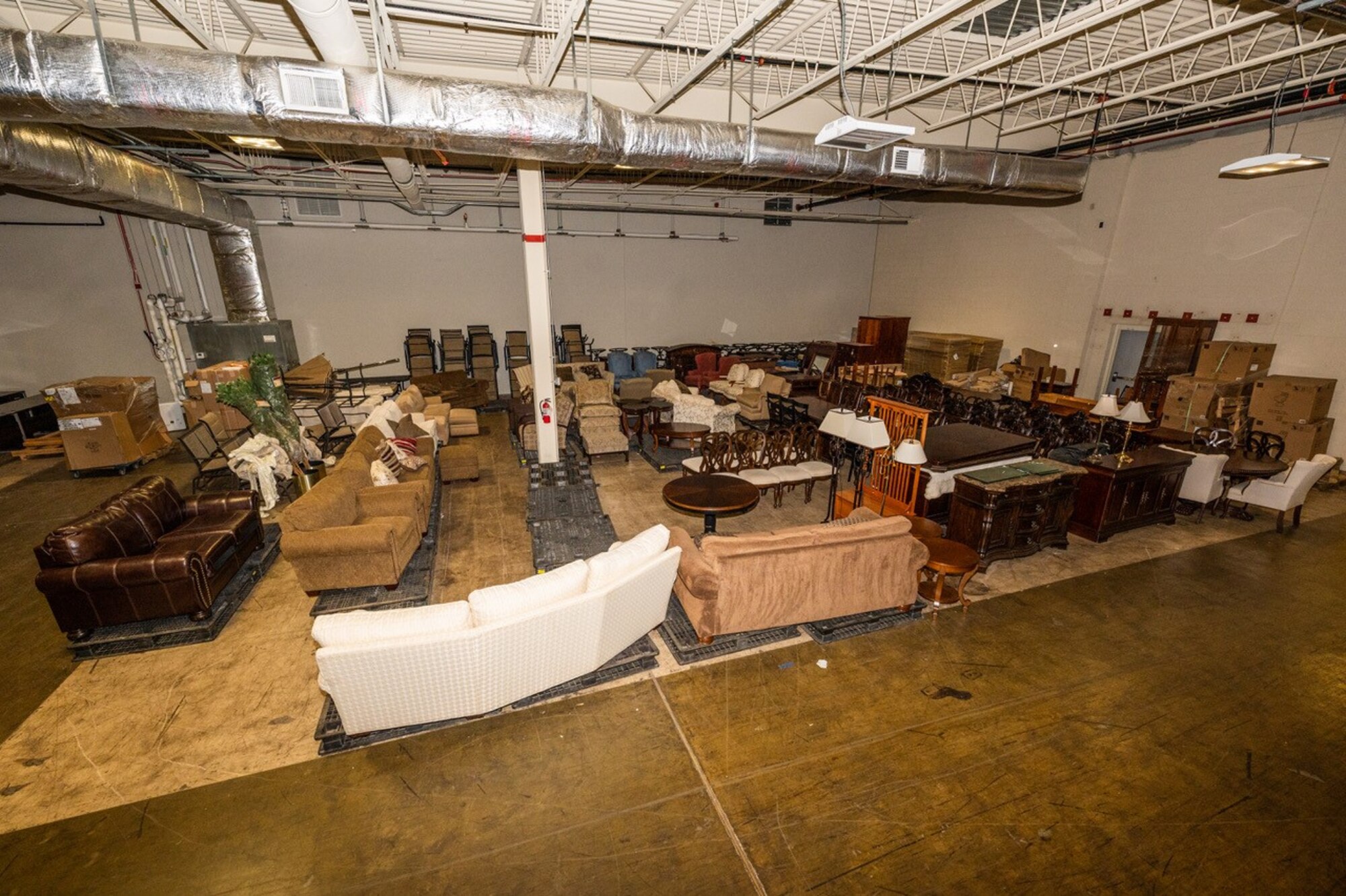 Furniture sits in a storage area.