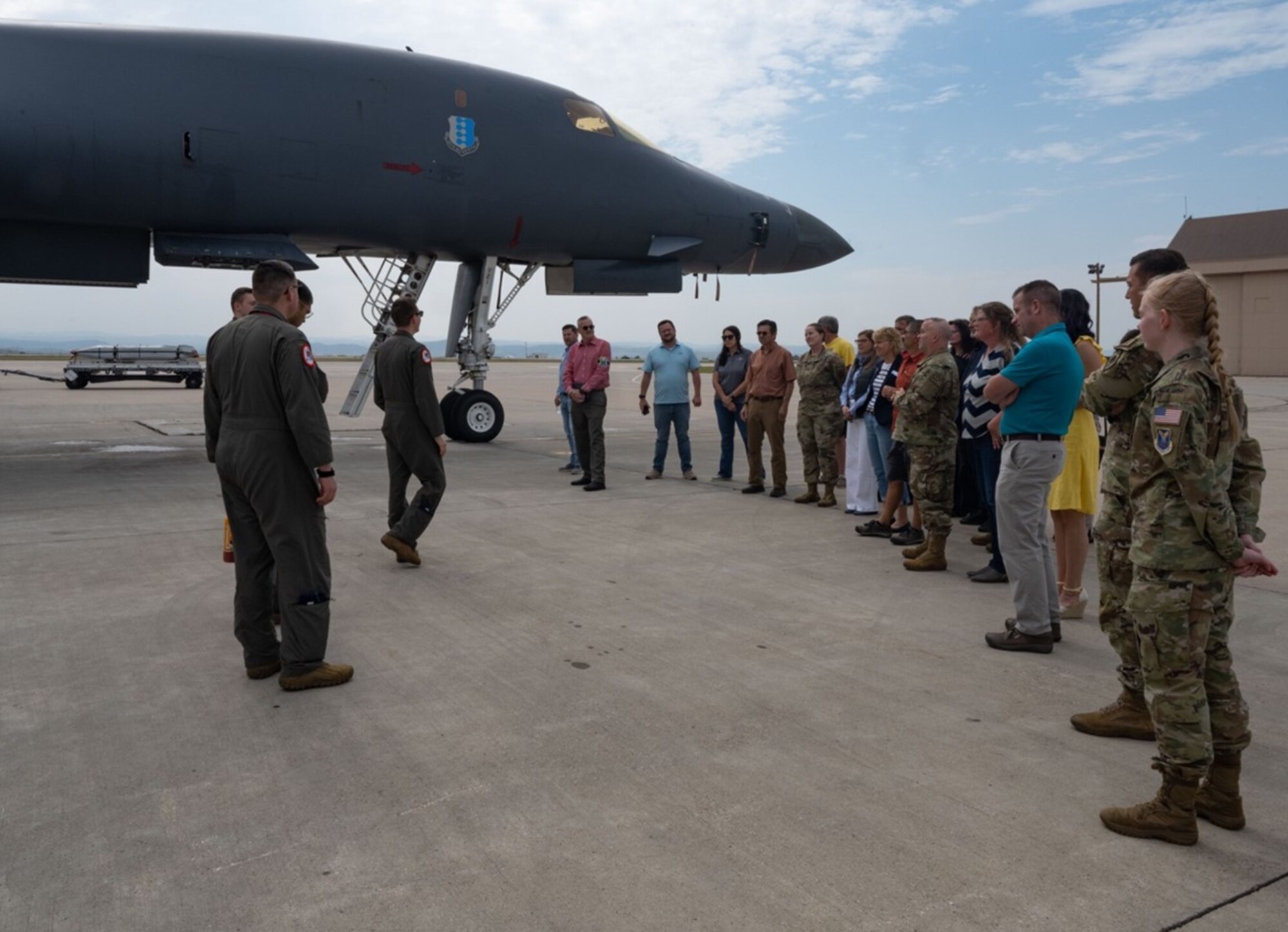 Aviators from the 34th Bomb Squadron “Thunderbirds” welcome Ellsworth Honorary Commanders and their respective base leaders as they arrive at the B-1B Lancer static display at Ellsworth Air Force Base, South Dakota, Aug. 25, 2023.
