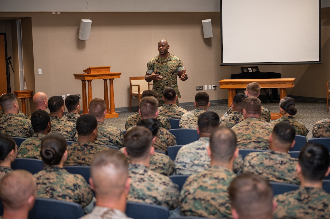 Marine Sgt. Maj. Wesley Turner 2nd Marine Logistics Group sergeant major, speaks to permanent party Marines here at an open discussion Wednesday in Specker Chapel.