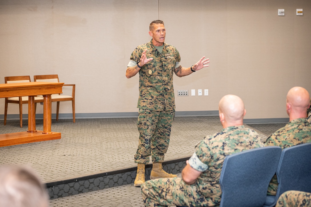 Navy Master Chief John Beck, 2nd Marine Logistics Group command master chief, speaks to permanent party Marines here at an open discussion Wednesday in Specker Chapel.