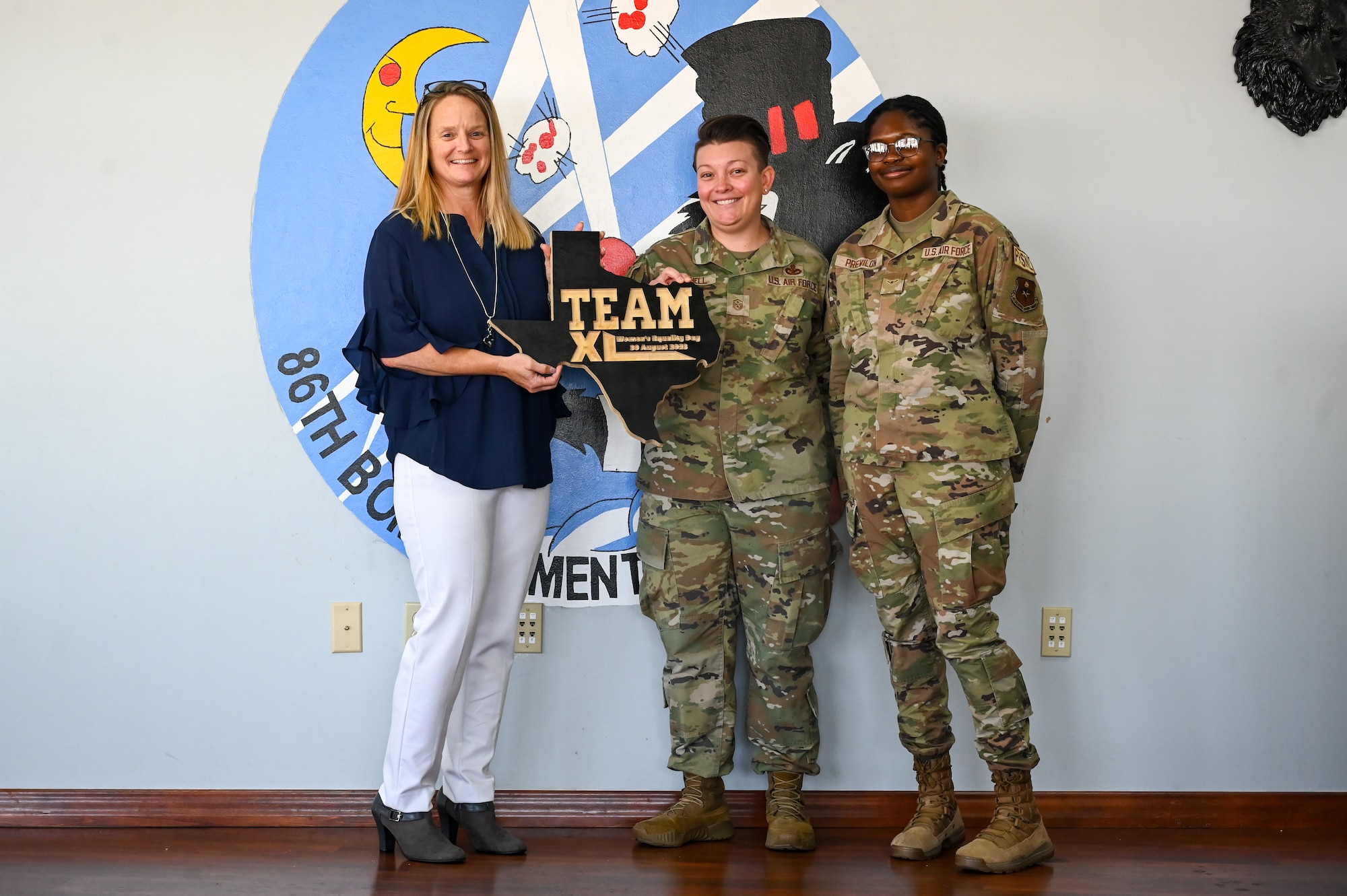 Team XL celebrated Women's Equality Day with a luncheon and guest speaker that provided a platform for women to discuss their experiences within the military Aug. 30, 2023.