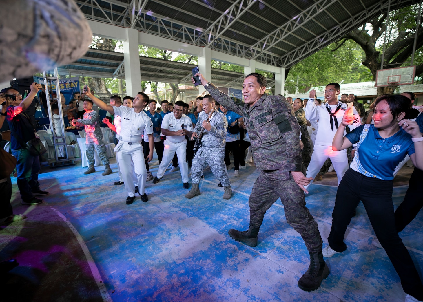 LA UNION, Philippines (Aug. 30. 2023) – Service members with the Armed Forces of the Philippines, U.S. Navy, Republic of Korea Cheon Ja Bong (LST-687), Australian Defense Forces students and civilians dance during a concert held at the end of the Pacific Partnership 2023 closing ceremony held at La Union National High School in San Fernando City, La Union, Philippines, Aug. 30.  Now in its 18th year, Pacific Partnership is the largest annual multinational humanitarian assistance and disaster relief preparedness mission conducted in the Indo-Pacific. (U.S. Navy photo by Mass Communication Specialist 1st Class Kegan E. Kay)