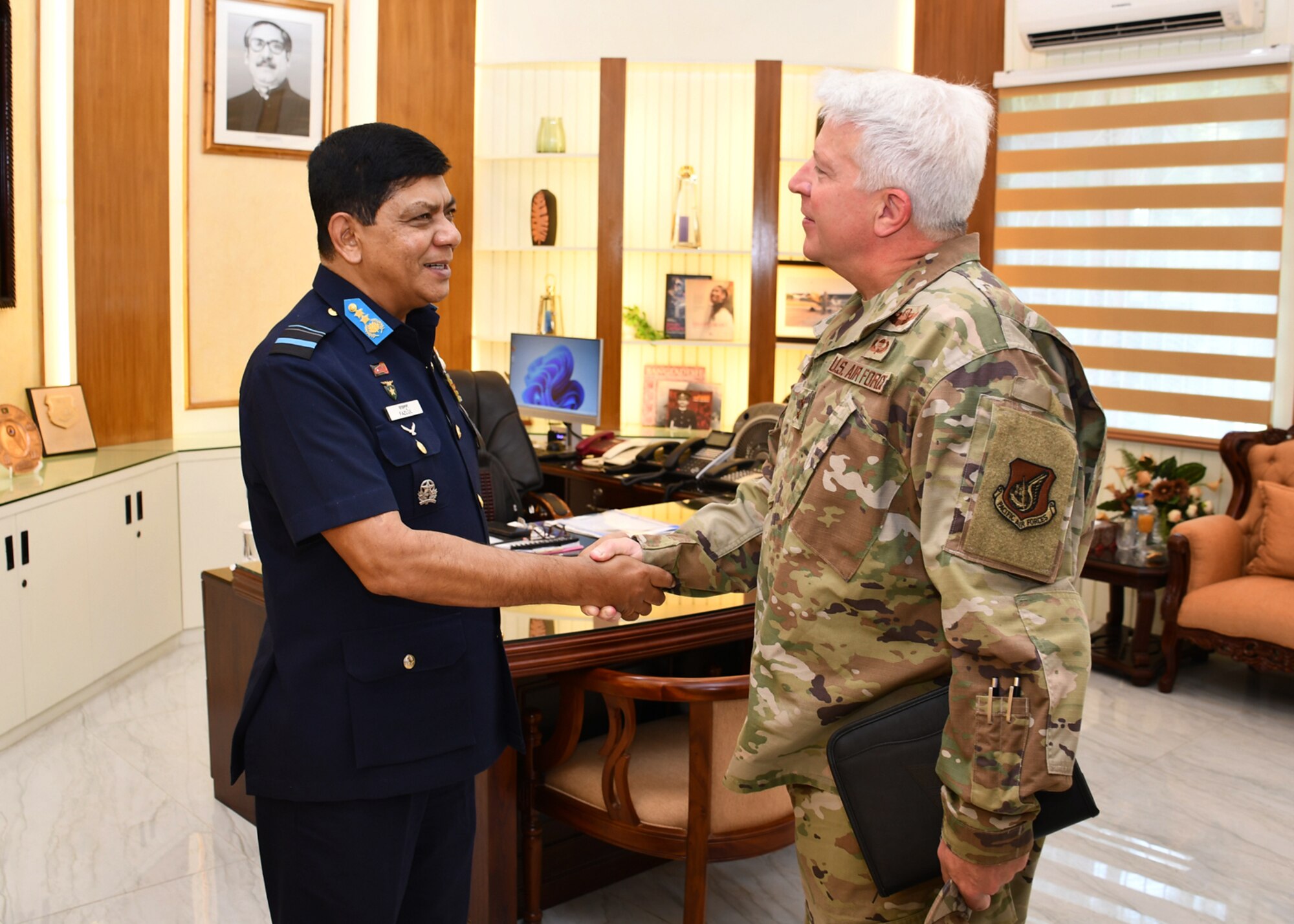 Photo of a U.S. Air Force General meeting with a Bangladesh Air Force Air Vice Marshal