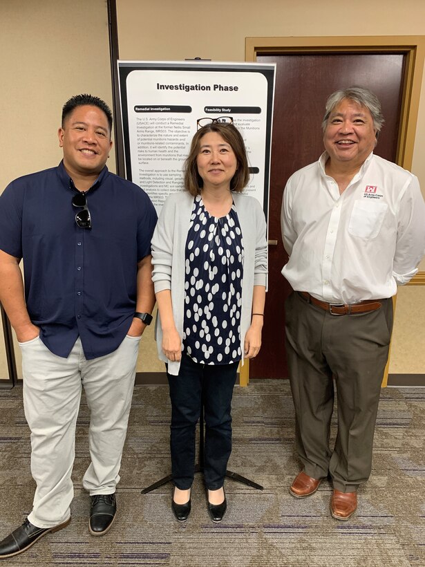 From left to right, Randy Tabije, South Pacific Division Formerly Used Defense Site program manager; Kay Chang-Minami, Los Angeles District FUDS project manager; and Harry Hendler, district environmental lead and FUDS program manager, stand together for photo after answering questions for Clark County residents during a public meeting discussing the Nellis Remedial Action FUDS Project July 25 at the Aliante Library in Las Vegas.