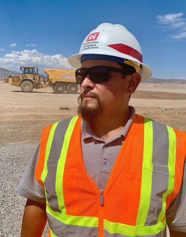 Mario Maldonado, an ordnance explosive safety specialist with the U.S. Army Corps of Engineers Los Angeles District, pictured during a site visit of the Nellis Remedial Action Munitions Response Site 02 and Site 03 July 25 in North Las Vegas. Site 02 remediation progress is moving according to schedule and will potentially conclude in late 2024. Maldonado works on several Formerly Used Defense Site projects in California, Nevada and Arizona.