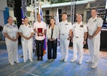 LA UNION, Philippines (Aug. 30. 2023) – Capt. Claudine Caluori, Pacific Partnership 2023 mission commander, second from the left, presents Mr. Hermengildo A. Gualberto, San Fernando City Mayor, a medallion, during the Pacific Partnership 2023 closing ceremony held at La Union National High School in San Fernando City, La Union, Philippines, Aug. 30.  Now in its 18th year, Pacific Partnership is the largest annual multinational humanitarian assistance and disaster relief preparedness mission conducted in the Indo-Pacific. (U.S. Navy photo by Mass Communication Specialist 1st Class Kegan E. Kay)