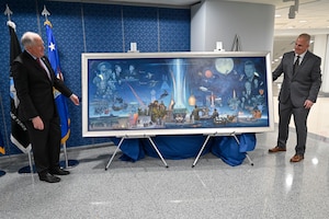 Secretary of the Air Force Frank Kendall, right, examines a painting by artist Warren Neary, second from left, after an unveiling ceremony at the Pentagon, Arlington, Va., Aug. 29, 2023. The painting celebrates the 75th anniversary of the U.S. Air Force. (U.S. Air Force photo by Eric Dietrich)