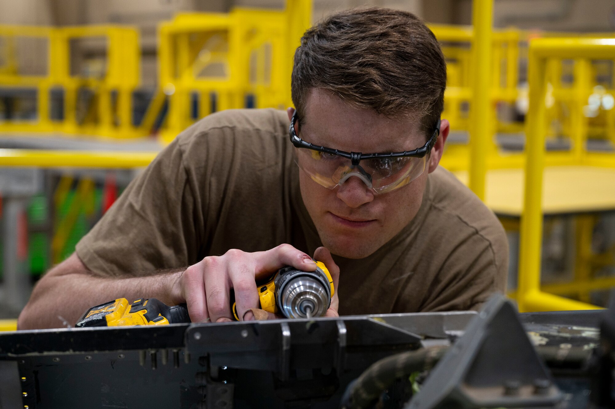 U.S. Air Force Staff Sgt. Braden Gibson, 49th Equipment Maintenance Squadron sheet metal shift lead, completes depot-level repairs on an F-16 Viper at Holloman Air Force Base, New Mexico, Aug. 1, 2023.