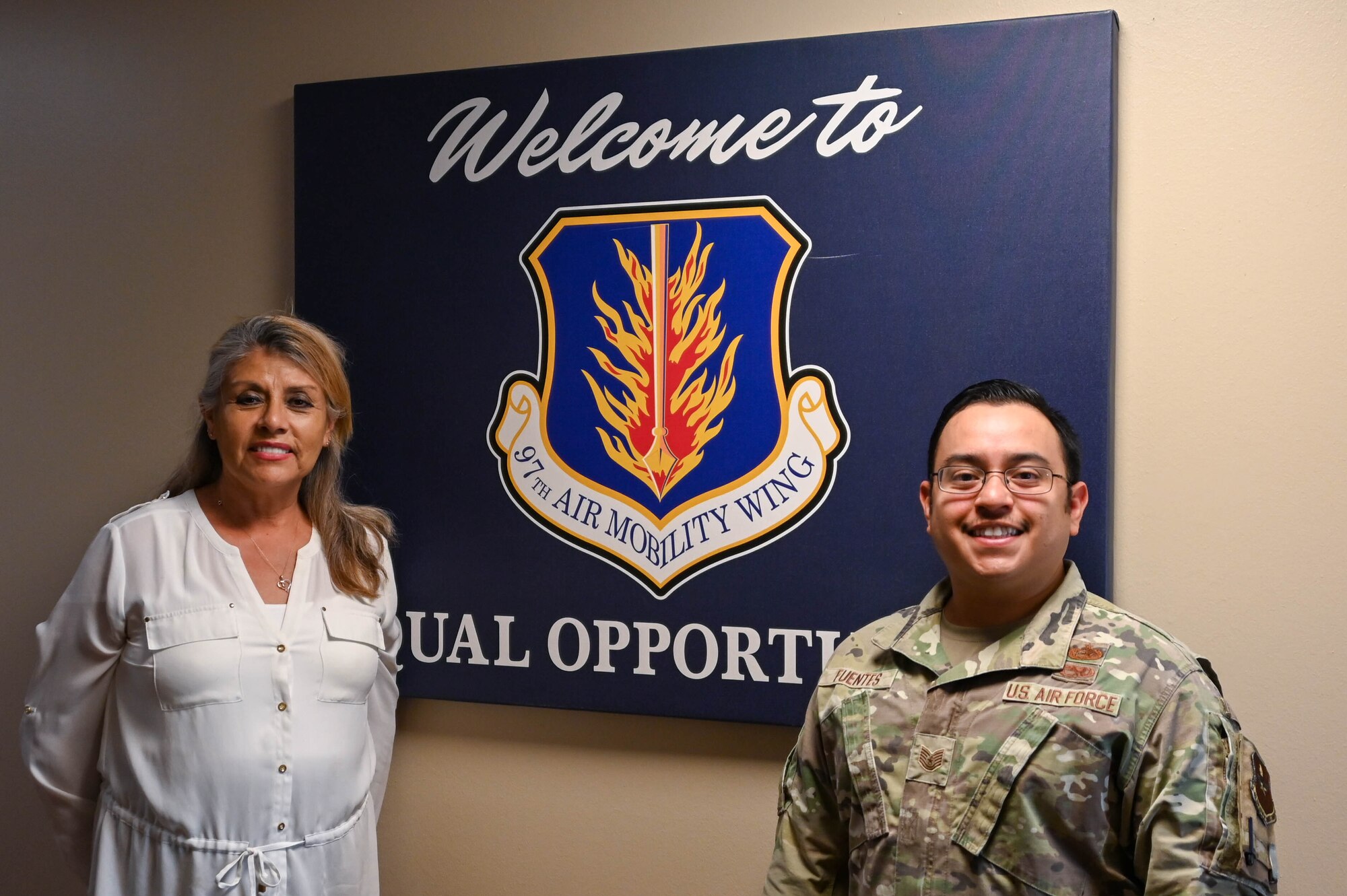 Alma Taylor, 97th Air Mobility Wing Equal Opportunity specialist (left) and U.S. Air Force Tech. Sgt. Jose Fuentes Jr, 97th Air Mobility Wing Equal Opportunity Program director (right), gather for a photo inside the Airmen Resiliency Center at Altus Air Force Base, Oklahoma, Aug. 16, 2023. The Equal Opportunity Program was created to identify and prohibit all forms of unlawful discrimination, harassment and retaliation within the U.S. Air Force. (U.S. Air Force photo by Airman 1st Class Heidi Bucins)