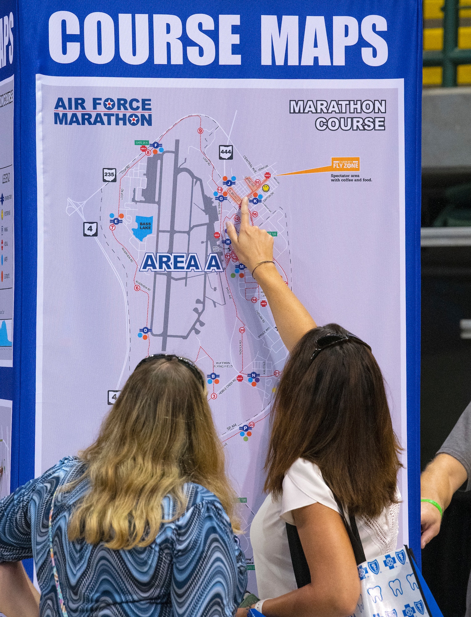 Race participants study the marathon course