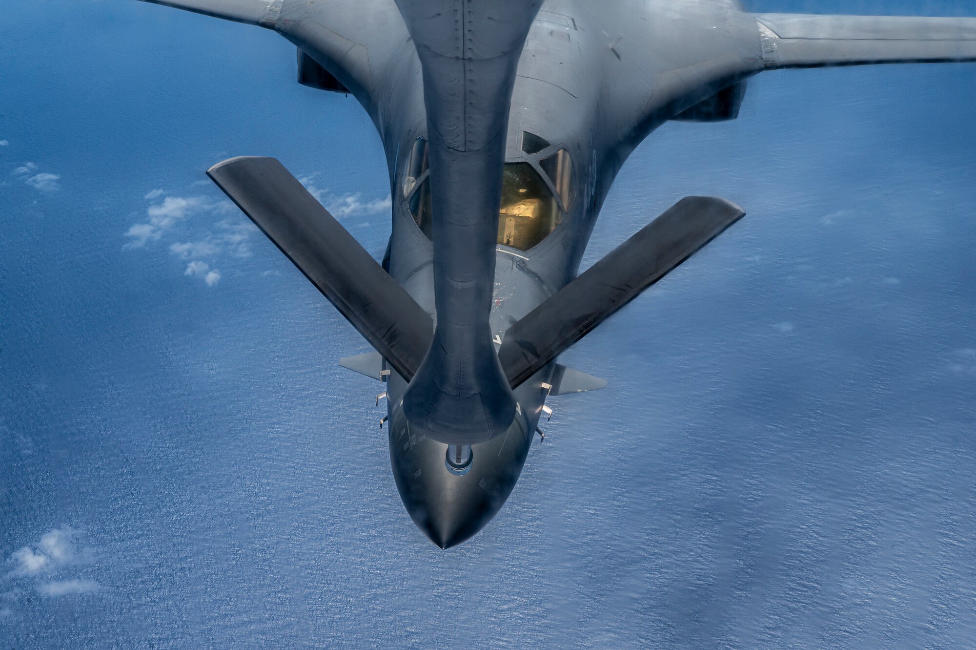 A B-1B Lancer assigned to the 28th Bomb Wing, Ellsworth Air Force Base, South Dakota, approaches a KC-135 Stratotanker from the 909th Air Refueling Squadron to receive fuel over the Sea of Japan, August 30, 2023.