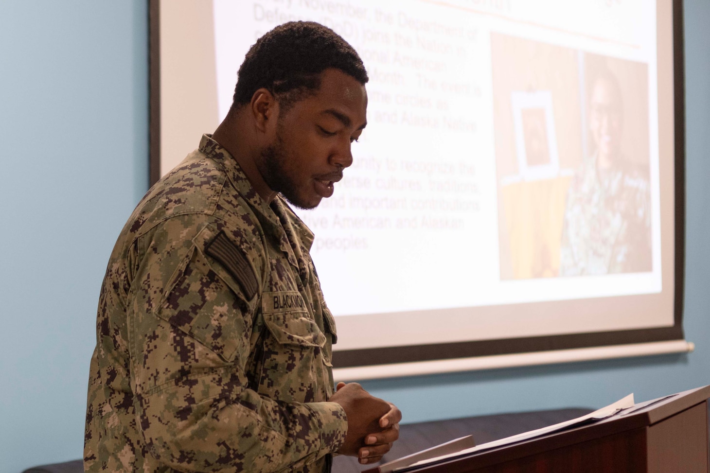 Machinist’s Mate Fireman Sedravius Blackmon, assigned to Naval Support Activity  Souda Bay, welcomes the audience as the master of ceremonies during a National American Indian Heritage Month event sponsored by the NSA Souda Bay Multicultural Heritage Committee on Nov. 30, 2023.