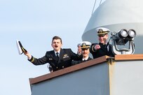 Sailors assigned to the Arleigh Burke-class guided-missile destroyer USS Paul Ignatius (DDG 117) celebrate their homecoming to Naval Station (NAVSTA) Rota as the ship returns from deployment, Nov. 28, 2023. As the "Gateway to the Mediterranean,” NAVSTA Rota provides U.S, NATO and allied forces a strategic hub for operations in Europe, Africa and the Middle East. NAVSTA Rota is a force multiplier, capable of promptly deploying and supporting combat-ready forces through land, air and sea, enabling warfighters and their families, sustaining the fleet and fostering the U.S. and Spanish partnership. (U.S. Navy photo by Mass Communication Specialist 2nd Class Drace Wilson)