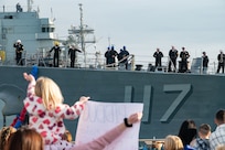 Families of Sailors assigned to the Arleigh Burke-class guided-missile destroyer USS Paul Ignatius (DDG 117) gather on the pier at Naval Station (NAVSTA) Rota as the ship returns from deployment, Nov. 28, 2023. As the "Gateway to the Mediterranean,” NAVSTA Rota provides U.S, NATO and allied forces a strategic hub for operations in Europe, Africa and the Middle East. NAVSTA Rota is a force multiplier, capable of promptly deploying and supporting combat-ready forces through land, air and sea, enabling warfighters and their families, sustaining the fleet and fostering the U.S. and Spanish partnership. (U.S. Navy photo by Mass Communication Specialist 2nd Class Drace Wilson)