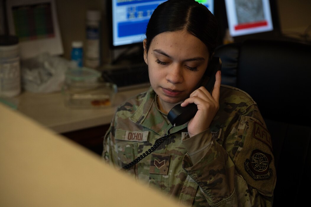 U.S. Air Force Senior Airman Christy Ochoa, 436th Operations Support Squadron airfield management operations shift lead, assists a caller with flightline access at Dover Air Force Base, Delaware, Nov. 27, 2023. The 436th OSS provides air traffic control, weather, intelligence, mission planning and more to ensure that Team Dover is always prepared to provide rapid global transportation. (U.S.