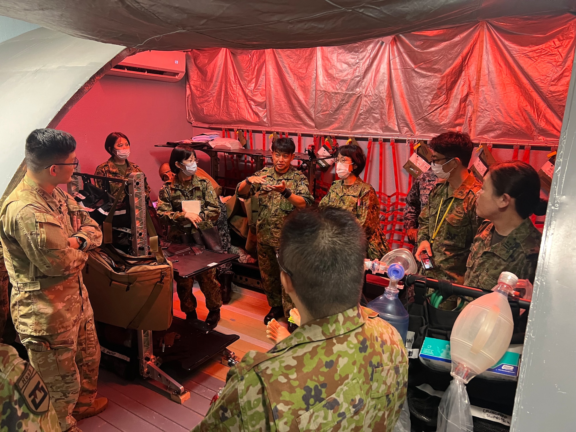JSDF personnel toured the 18th AES Training Sustainment Center, where a KC-135 simulator is used as a ground training device to accomplish clinical and flight training requirements for Aeromedical Evacuation crewmembers. (Courtesy Photo)