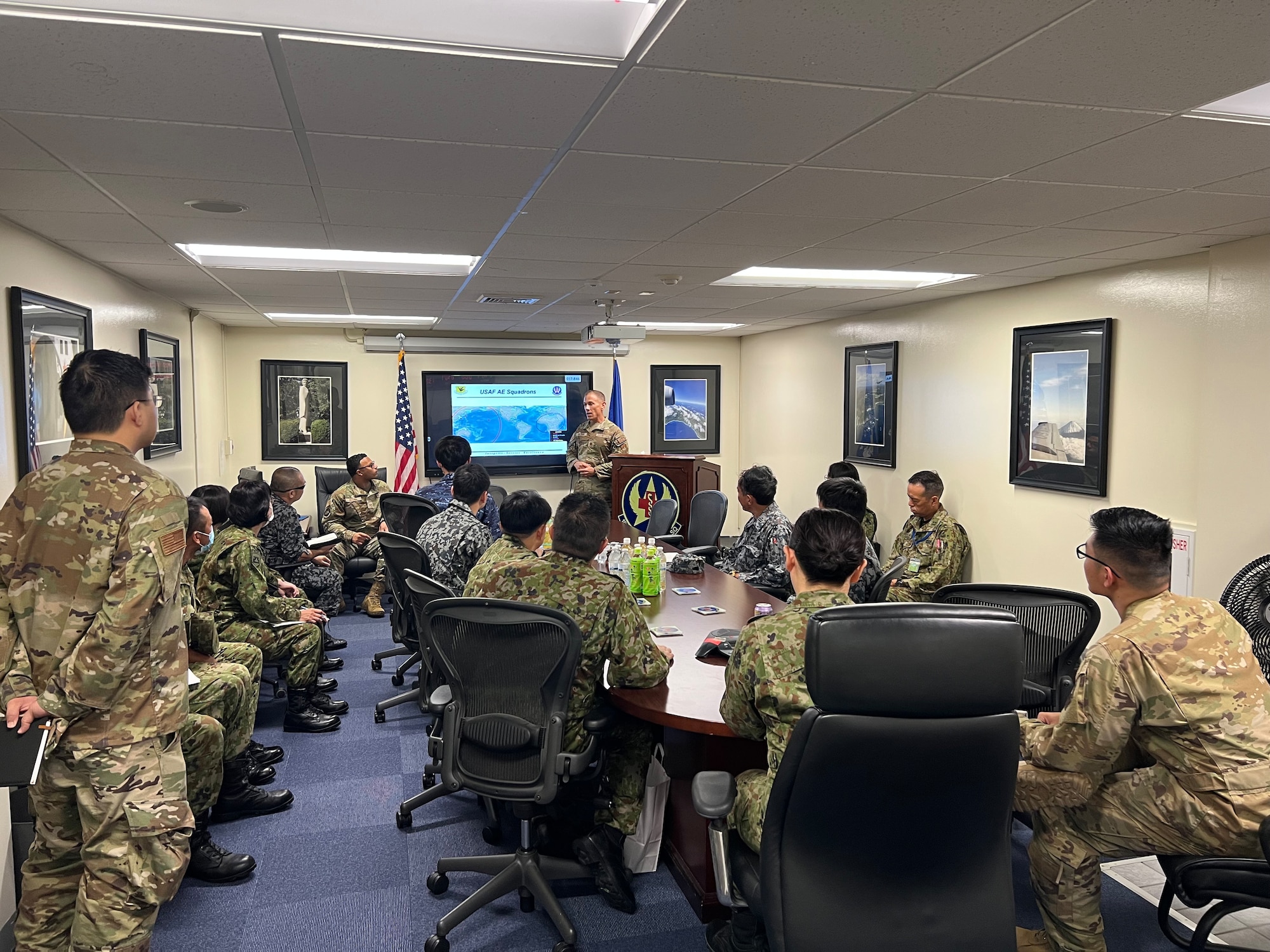 Maj. Christian Coleman, Director of Operations, provides the 18th AES mission brief to the JSDF medical team. (Courtesy Photo)