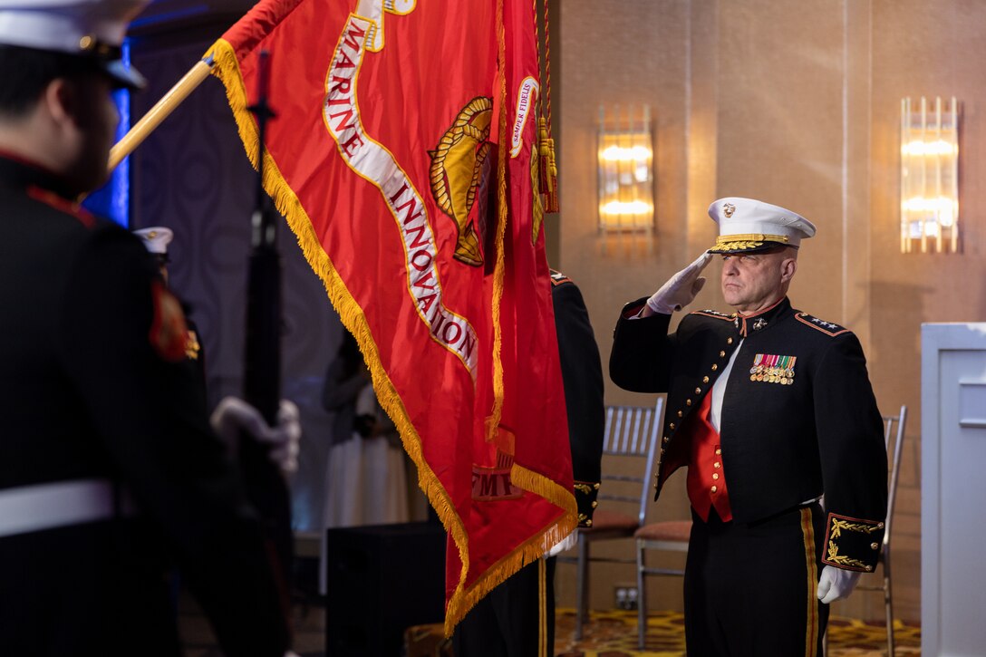 U.S. Marine Corps Lt. Gen. David G. Bellon, commander of Marine Forces Reserve and Marine Forces, South, salutes the colors during the Marine Corps' 248th birthday ball hosted by the Marine Innovation Unit, Queens, New York, Nov. 5, 2023. Stood up in March 2022, MIU leverages existing Marine talent in order to: accelerate the adoption of advanced capabilities; transform Naval Service capacity for technology employment; and retain and invest in Total Force human capital. (U.S. Marine Corps photo by Lance Cpl. David Intriago)