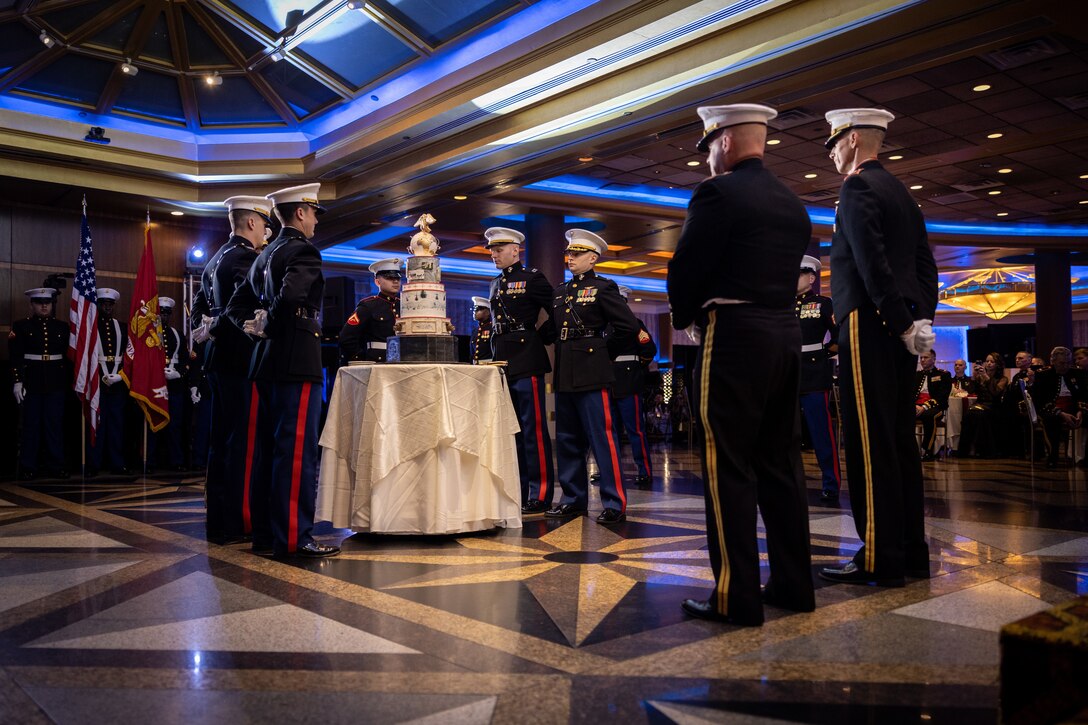 U.S. Marines, Marine Innovation Unit, present the cake during their Marine Corps' 248th birthday ball, Queens, New York, Nov. 5, 2023. Stood up in March 2022, MIU leverages existing Marine talent in order to: accelerate the adoption of advanced capabilities; transform Naval Service capacity for technology employment; and retain and invest in Total Force human capital. (U.S. Marine Corps photo by Lance Cpl. David Intriago)