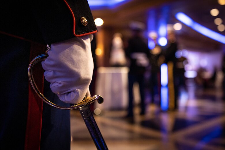 U.S. Marines with the Marine Innovation Unit present the cake during their Marine Corps' 248th birthday ball, Queens, New York, Nov. 5, 2023. Stood up in March 2022, MIU leverages existing Marine talent in order to: accelerate the adoption of advanced capabilities; transform Naval Service capacity for technology employment; and retain and invest in Total Force human capital. (U.S. Marine Corps photo by Lance Cpl. David Intriago)