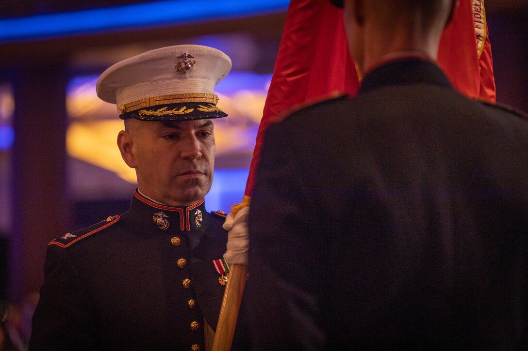 U.S. Marine Corps Col. Brooks Braden, commanding officer of the Marine Innovation Unit, receives the colors during a change of command ceremony, Queens, New York, Nov. 5, 2023. The ceremony occurred at a ball hosted by MIU, celebrating the Marine Corps' 248th annual birthday. Stood up in March 2022, MIU leverages existing Marine talent in order to: accelerate the adoption of advanced capabilities; transform Naval Service capacity for technology employment; and retain and invest in Total Force human capital. (U.S. Marine Corps photo by Lance Cpl. David Intriago)