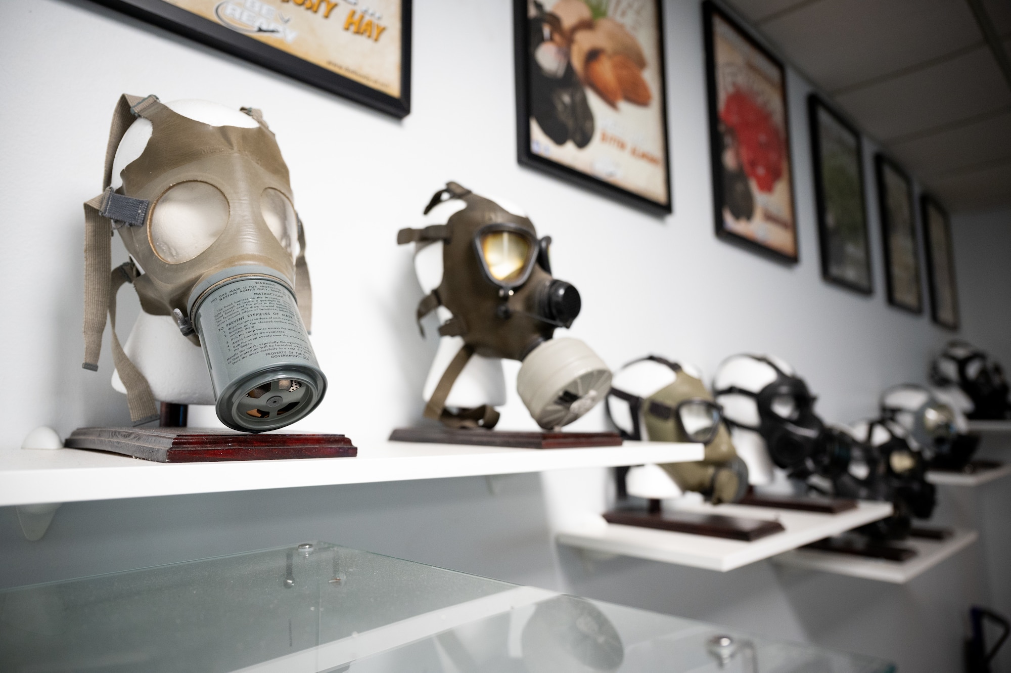 Protective masks are displayed on a shelf.