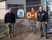 Rear Adm. Robert Wirth, J5N, U.S. Strategic Command deputy director, strategic targeting and nuclear mission planning, Col. James Schlabach, 91st Operations Group commander and U.S. Air Force Staff Sgt. Kyel Collins, 91st missile wing facility manager (FM), pose for a photo at Missile Alert Facility (MAF) Oscar-1, North Dakota, Nov. 29, 2023. The 24/7 responsibility of an FM requires nonstop vigilance. (U.S. Air Force photo by Airman 1st Class Alexander Nottingham)