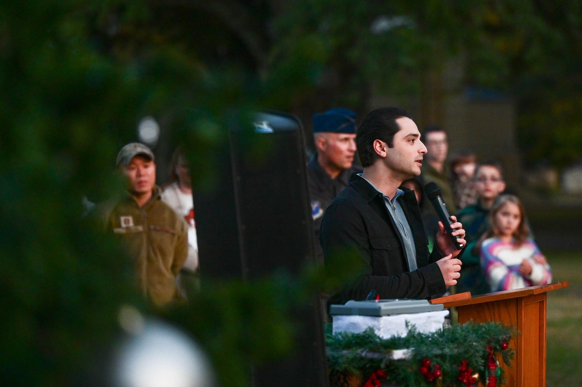Capt. Trent Waller speaks outside at a podium