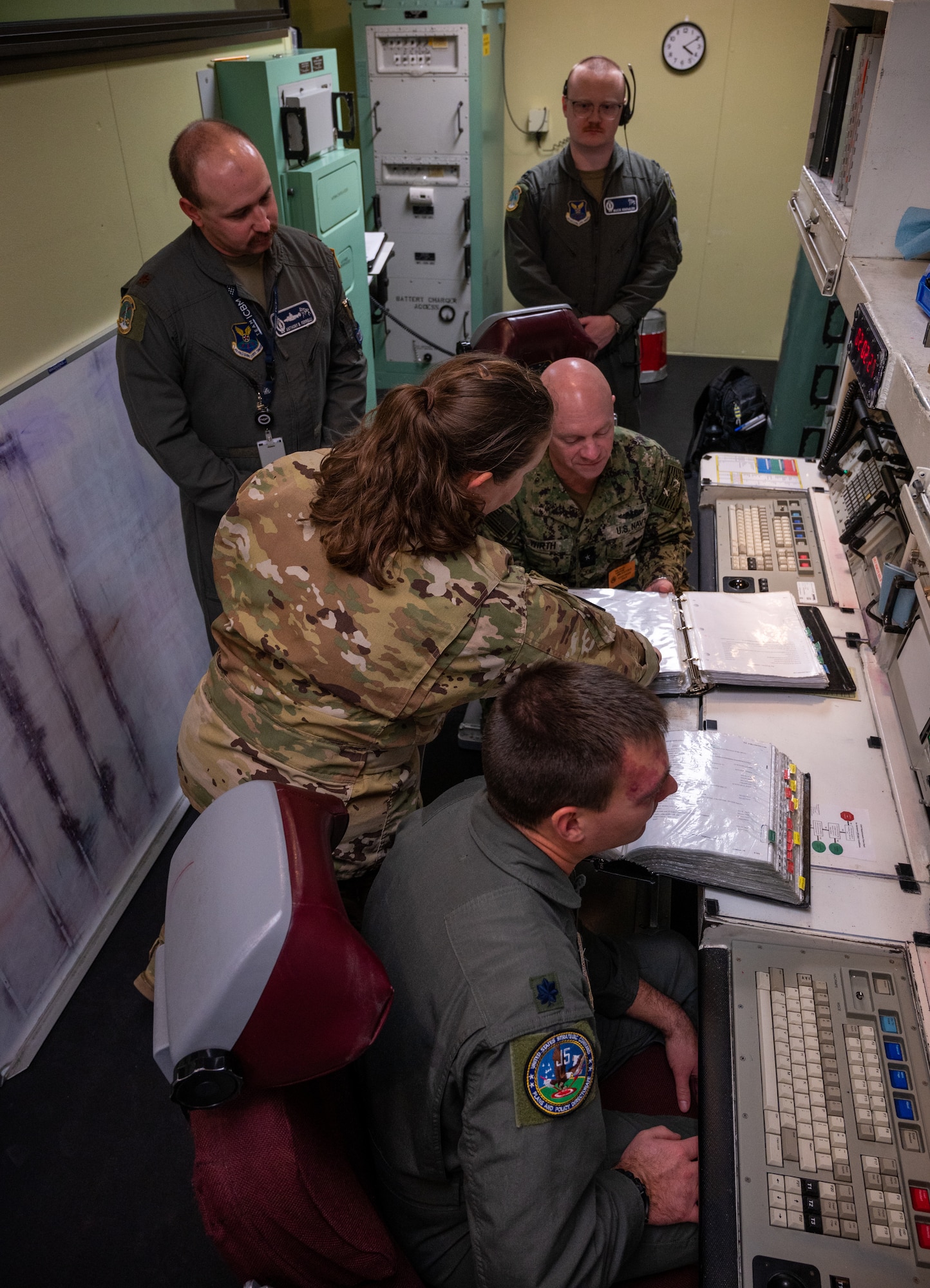 Rear Adm. Robert Wirth, J5N, U.S. Strategic Command deputy director, strategic targeting and nuclear mission planning, receives a demonstration at a missile procedure trainer (MPT) at Minot Air Force Base, North Dakota, Nov. 29, 2023. The MPT mimics the environment of a launch control center (LCC) which is used at the LCC’s to monitor and control missile launch facilities. (U.S. Air Force photo by Airman 1st Class Alexander Nottingham)