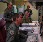 Rear Adm. Robert Wirth, J5N, U.S. Strategic Command deputy director, strategic targeting and nuclear mission planning, receives a demonstration at a Missile Procedure Trainer (MPT) at Minot Air Force Base, North Dakota, Nov. 29, 2023. The MPT mimics the environment of a launch control center which is used in the field to monitor and control missile launch facilities. (U.S. Air Force photo by Airman 1st Class Alexander Nottingham)