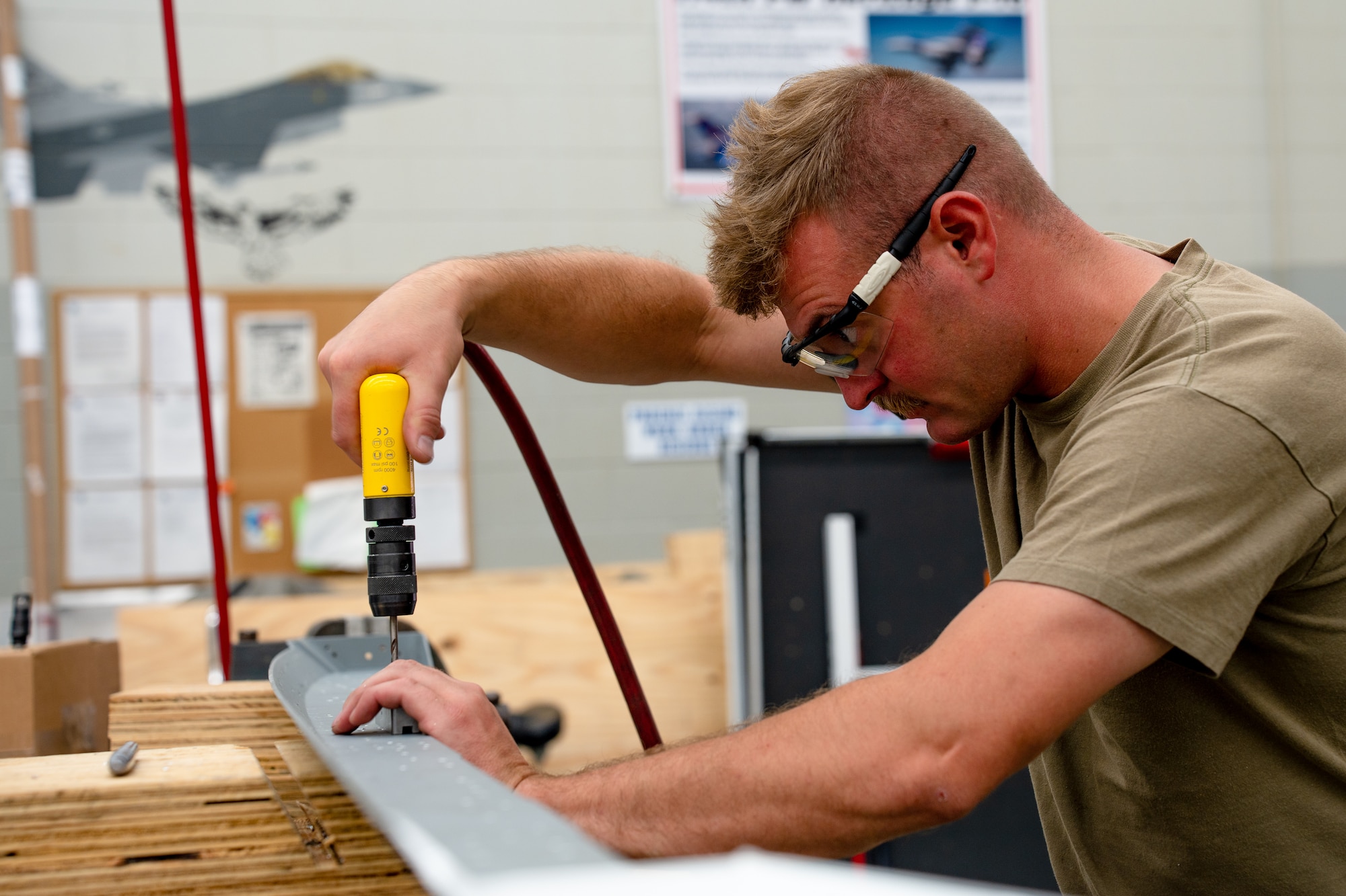 Tech Sgt. Tyler Martin, 14th Maintenance Squadron aircraft structural airman, drills a hole on a canopy sill longeron template to ensure the holes are properly lined up prior to drilling on the actual CSL.