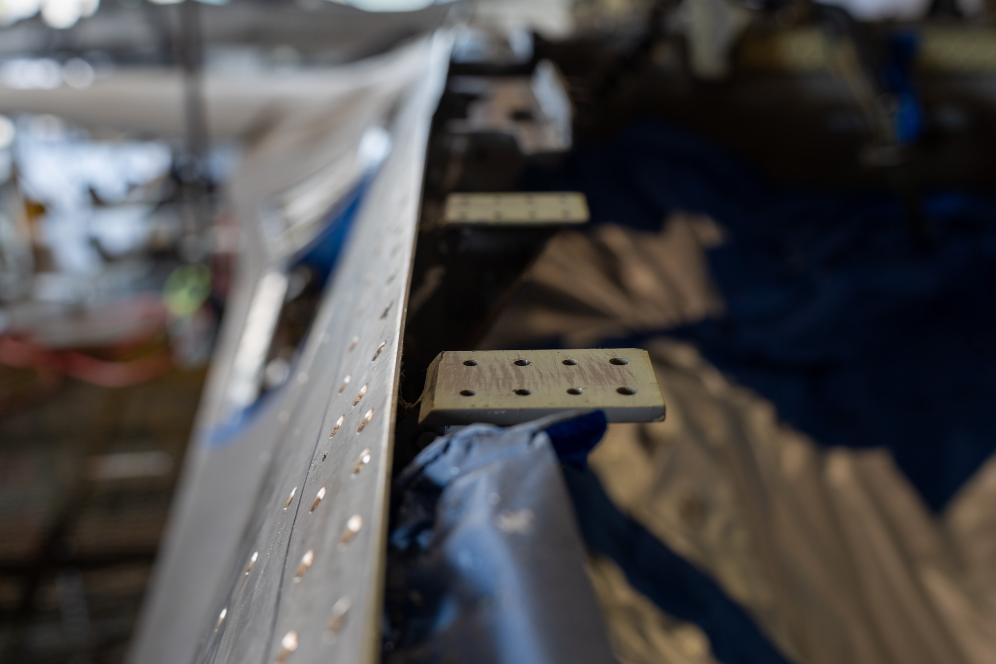 Mounting holes for the canopy sill longeron on a F-16 during the canopy sill longeron repair.