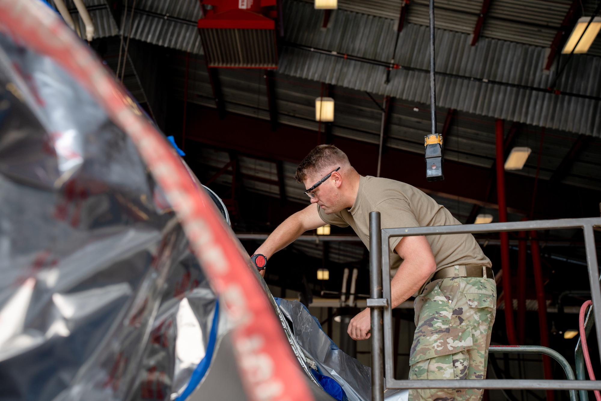 Staff Sgt. Staff Sgt. Bryce Engbarth, 114th Maintenance Squadron aircraft structural airman, works on removing parts on a F-16 during the canopy sill longeron repair.