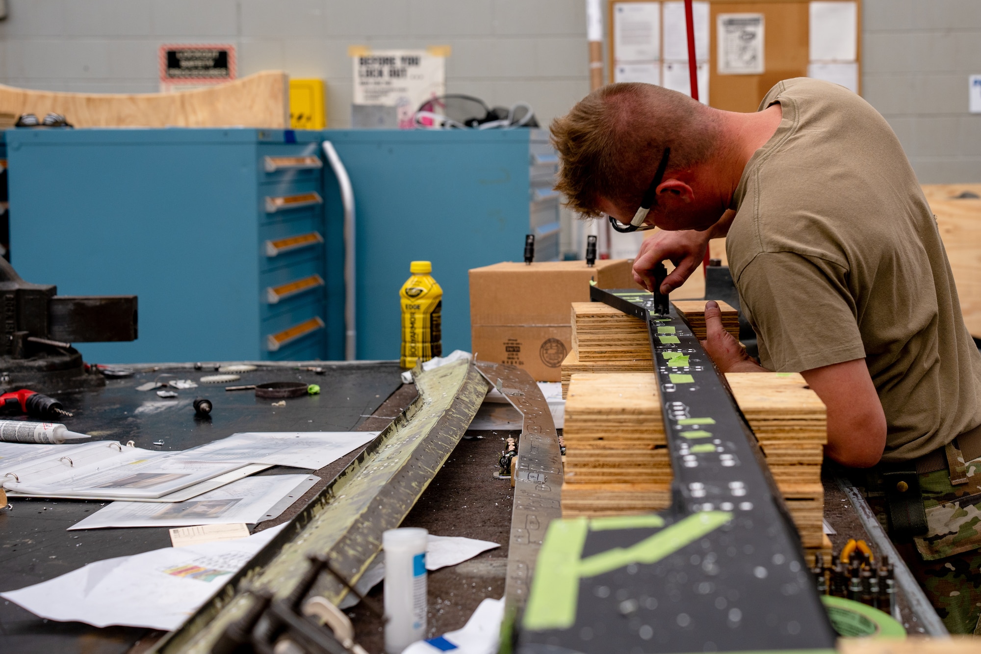 Tech Sgt. Tyler Martin, 14th Maintenance Squadron aircraft structural airman, checks the hole size on a canopy sill longeron template to ensure the holes are properly lined up prior to drilling on the actual CSL.