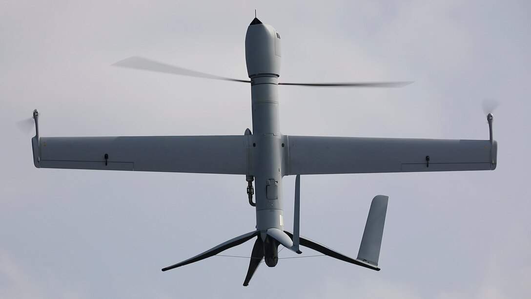 An unmanned aerial vehicle is photographed while in flight.