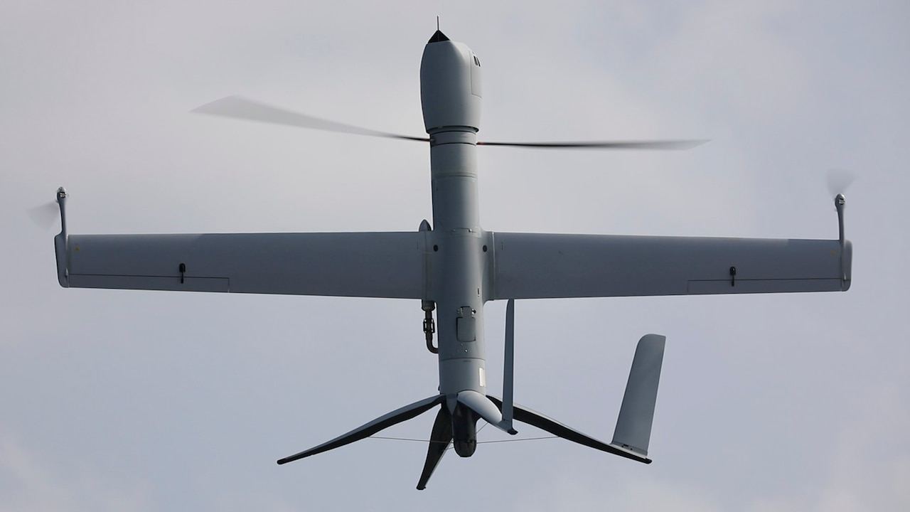 An unmanned aerial vehicle is photographed while in flight.