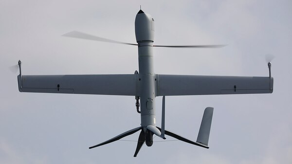 An unmanned aerial vehicle is photographed while in flight.