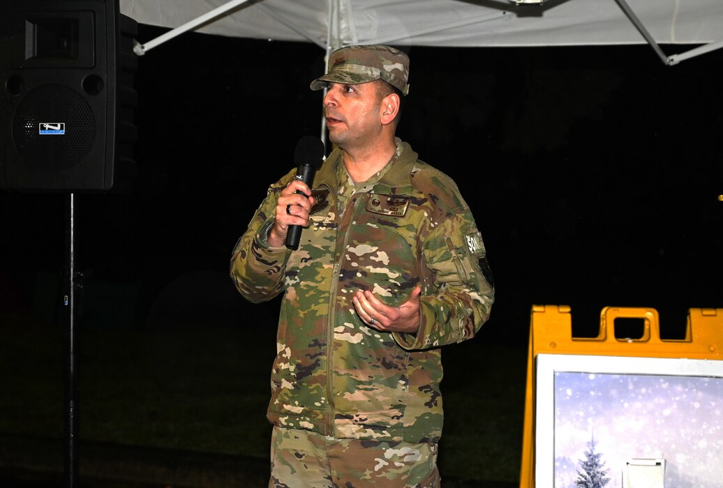 Despite the drizzle common to the Pacific Northwest, Team McChord Airmen and families gather to witness the annual holiday tree lighting ceremony at Joint Base Lewis-McChord, Wash., Nov. 30, 2023. Hot chocolate, cookies, and other desserts were provided by the USO. Children were able to take pictures with Mrs. and Mr. Clause along with two gingerbread men. Providing holiday recreational family activities is one of the ways Team McChord develop ready Airmen and families.