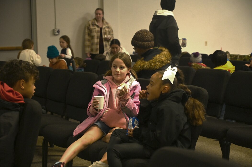 Despite the drizzle common to the Pacific Northwest, Team McChord Airmen and families gather to witness the annual holiday tree lighting ceremony at Joint Base Lewis-McChord, Wash., Nov. 30, 2023. Hot chocolate, cookies, and other desserts were provided by the USO. Children were able to take pictures with Mrs. and Mr. Clause along with two gingerbread men. Providing holiday recreational family activities is one of the ways Team McChord develop ready Airmen and families.