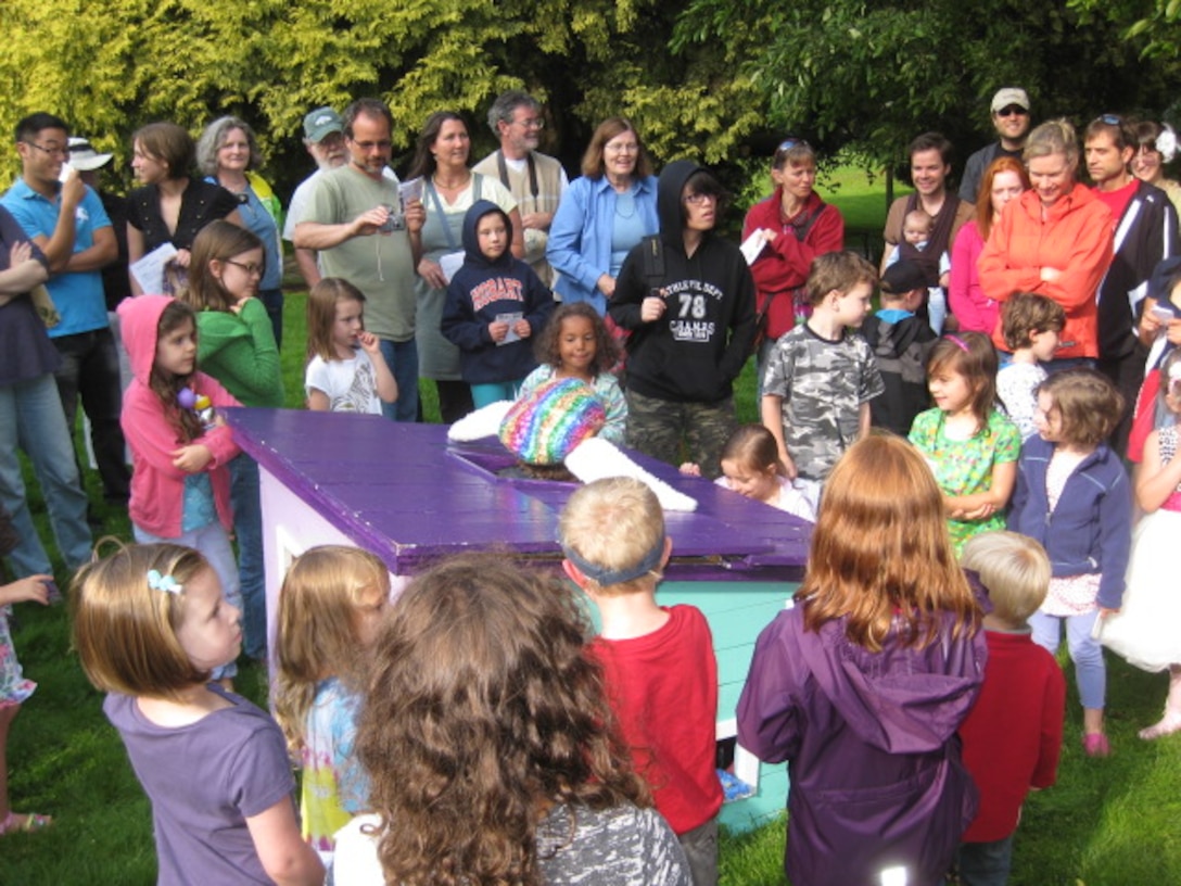 Photo of a group of Alice in Wonderland scavenger hunt participants on the grounds of the Charles S. English Jr. Botanical Garden, Lake Washington Ship Canal, Seattle.