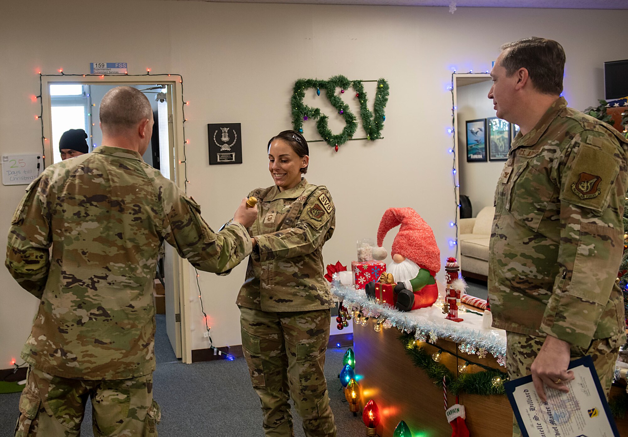 U.S. Air Force leadership present gifts to an Airman