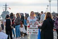 Families of Sailors assigned to the Arleigh Burke-class guided-missile destroyer USS Paul Ignatius (DDG 117) gather on the pier at Naval Station (NAVSTA) Rota as the ship returns from deployment, Nov. 28, 2023. As the "Gateway to the Mediterranean,” NAVSTA Rota provides U.S, NATO and allied forces a strategic hub for operations in Europe, Africa and the Middle East. NAVSTA Rota is a force multiplier, capable of promptly deploying and supporting combat-ready forces through land, air and sea, enabling warfighters and their families, sustaining the fleet and fostering the U.S. and Spanish partnership. (U.S. Navy photo by Mass Communication Specialist 2nd Class Drace Wilson)
