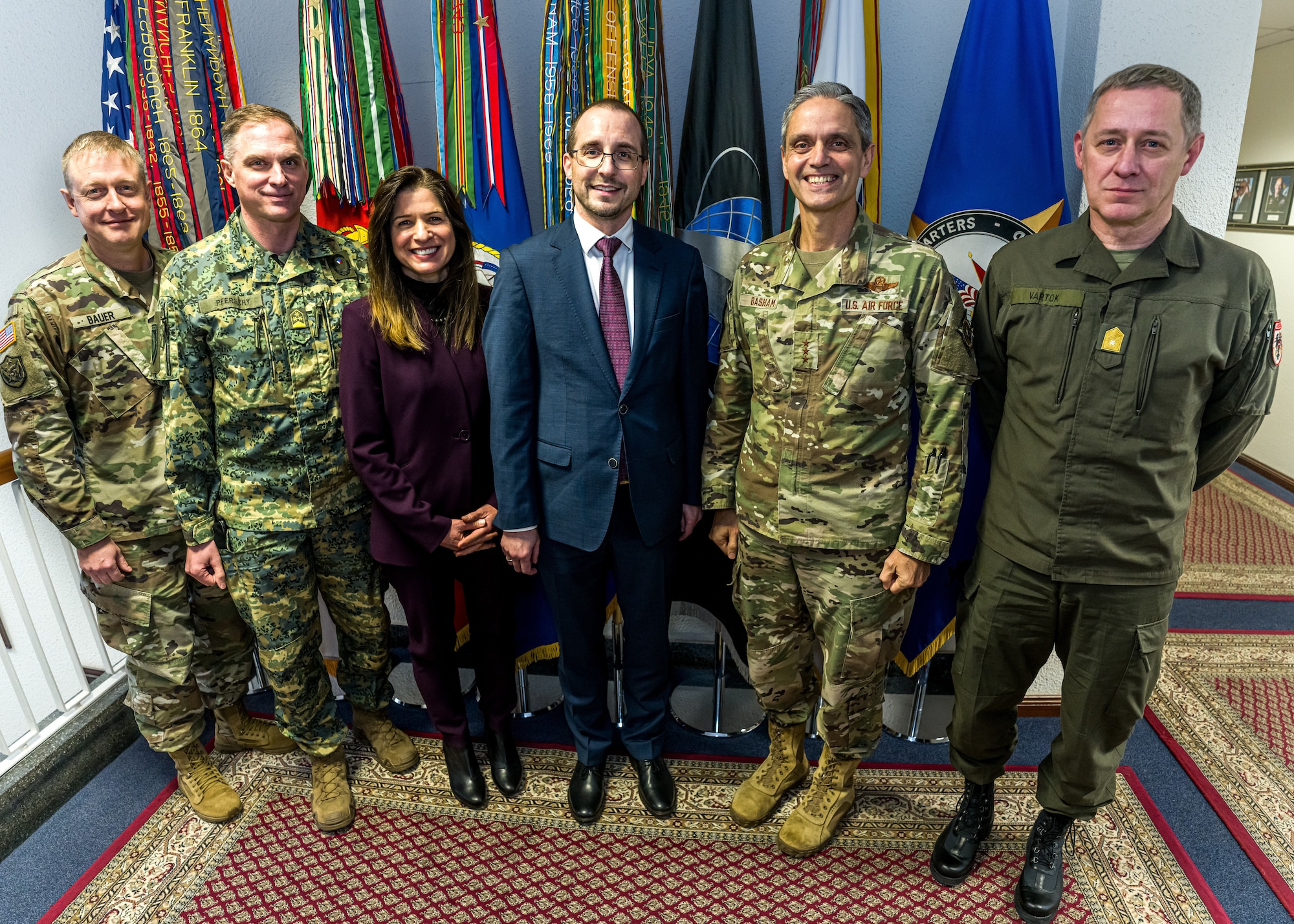 U.S. Air Force Lt. Gen. Steven Basham, second from right, U.S. European Command deputy commander; and Ambassador Kate Marie Byrnes, third from left, civilian deputy and foreign policy advisor to U.S. European Command; host Arnold Kammel, center, secretary general of the Austrian Ministry of Defense, and members of Kammel’s staff at the command’s headquarters in Stuttgart, Germany, Nov. 30, 2023. The meeting was aimed at identifying areas for future military cooperation and builds on a the State Partnership Program relationship between Austria and the Vermont National Guard.