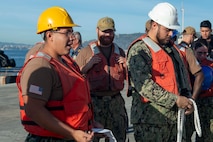 Sailors assigned to Naval Support Activity (NSA) Souda Bay’s port operations team review the proper techniques for heaving line before bringing in the first-in-class aircraft carrier USS Gerald R. Ford (CVN 78) as the ship arrives in Souda Bay, Crete, for a scheduled port visit on Dec. 2, 2023. USS Gerald R. Ford Carrier Strike Group is on a scheduled deployment in the U.S. Naval Forces Europe-Africa area of operations, employed by U.S. Sixth Fleet to defend U.S., allied and partner interests. NSA Souda Bay is an operational ashore installation which enables and supports U.S., Allied, Coalition, and Partner nation forces to preserve security and stability in the European, African, and Central Command areas of Team Souda, Souda Bay, Crete, Greece, Navy Region Europe Africa Central (EURAFCENT)
responsibility. (U.S. Navy photo by Mass Communication Specialist 1st Class Delaney S. Jensen)