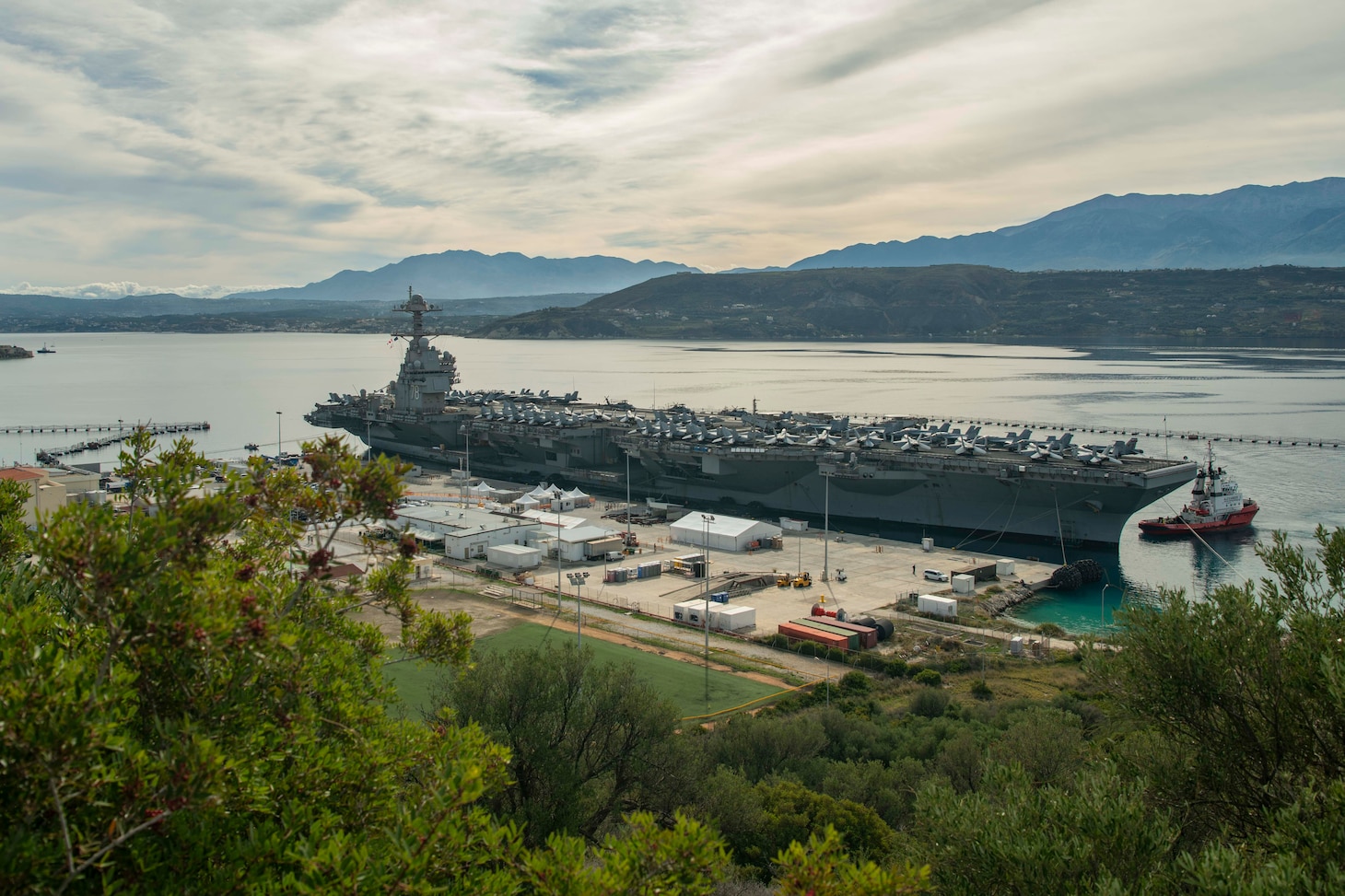 The first-in-class aircraft carrier USS Gerald R. Ford (CVN 78) arrives in Souda Bay, Crete, for a scheduled port visit on Dec. 2, 2023. USS Gerald R. Ford Carrier Strike Group is on a scheduled deployment in the U.S. Naval Forces Europe-Africa area of operations, employed by U.S. Sixth Fleet to defend U.S., allied and partner interests. NSA Souda Bay is an operational ashore installation which enables and supports U.S., Allied, Coalition, and Partner nation forces to preserve security and stability in the European, African, and Central Command areas of responsibility. (U.S. Navy photo by Mass Communication Specialist 1st Class Delaney S. Jensen)