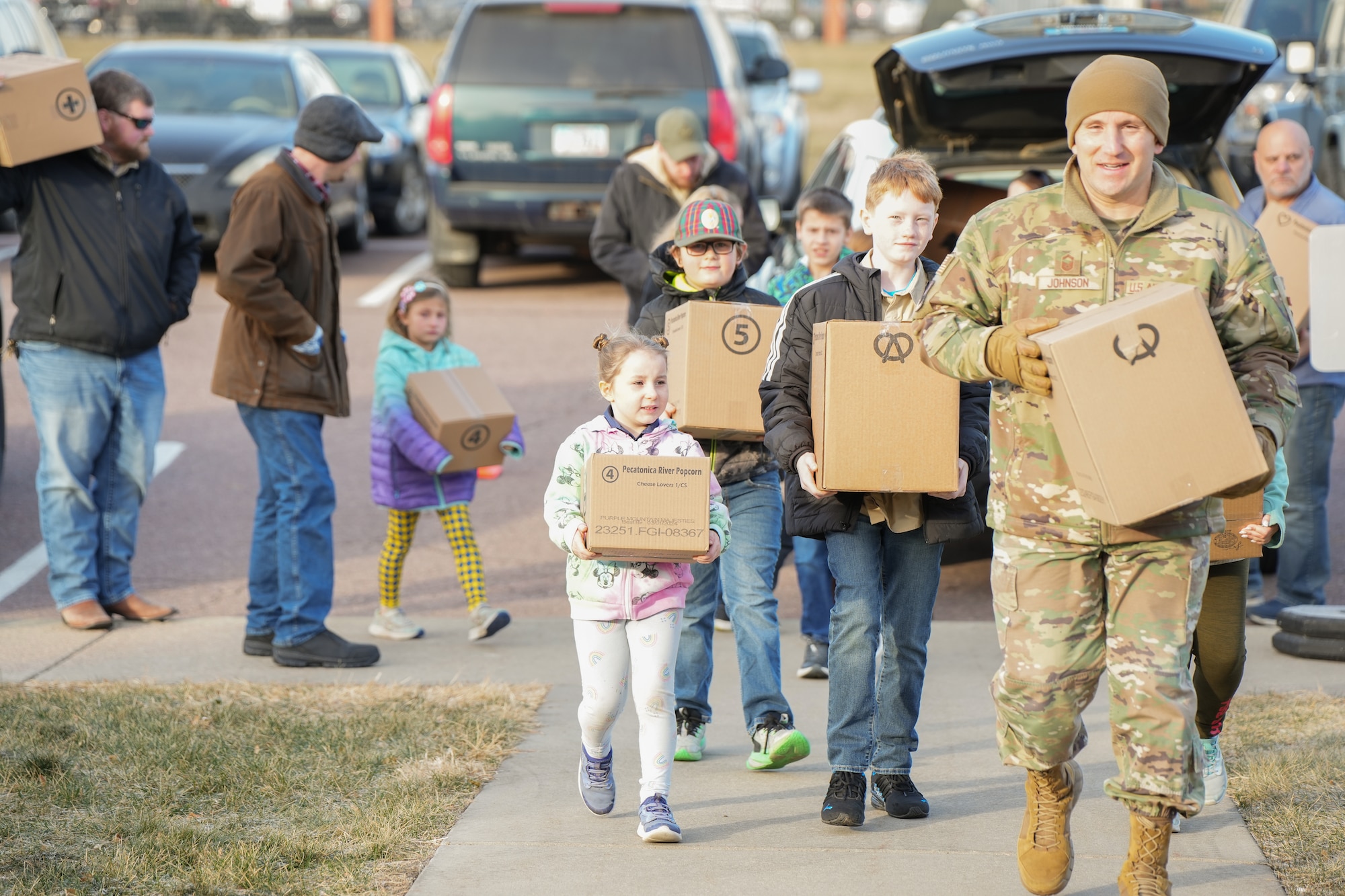 Boy Scouts of America Sioux Council Pack 208 bring popcorn to members of the South Dakota Air National Guard during December's unit training assembly, marking the launch of a partnership between the two organizations, December 2, 2023.