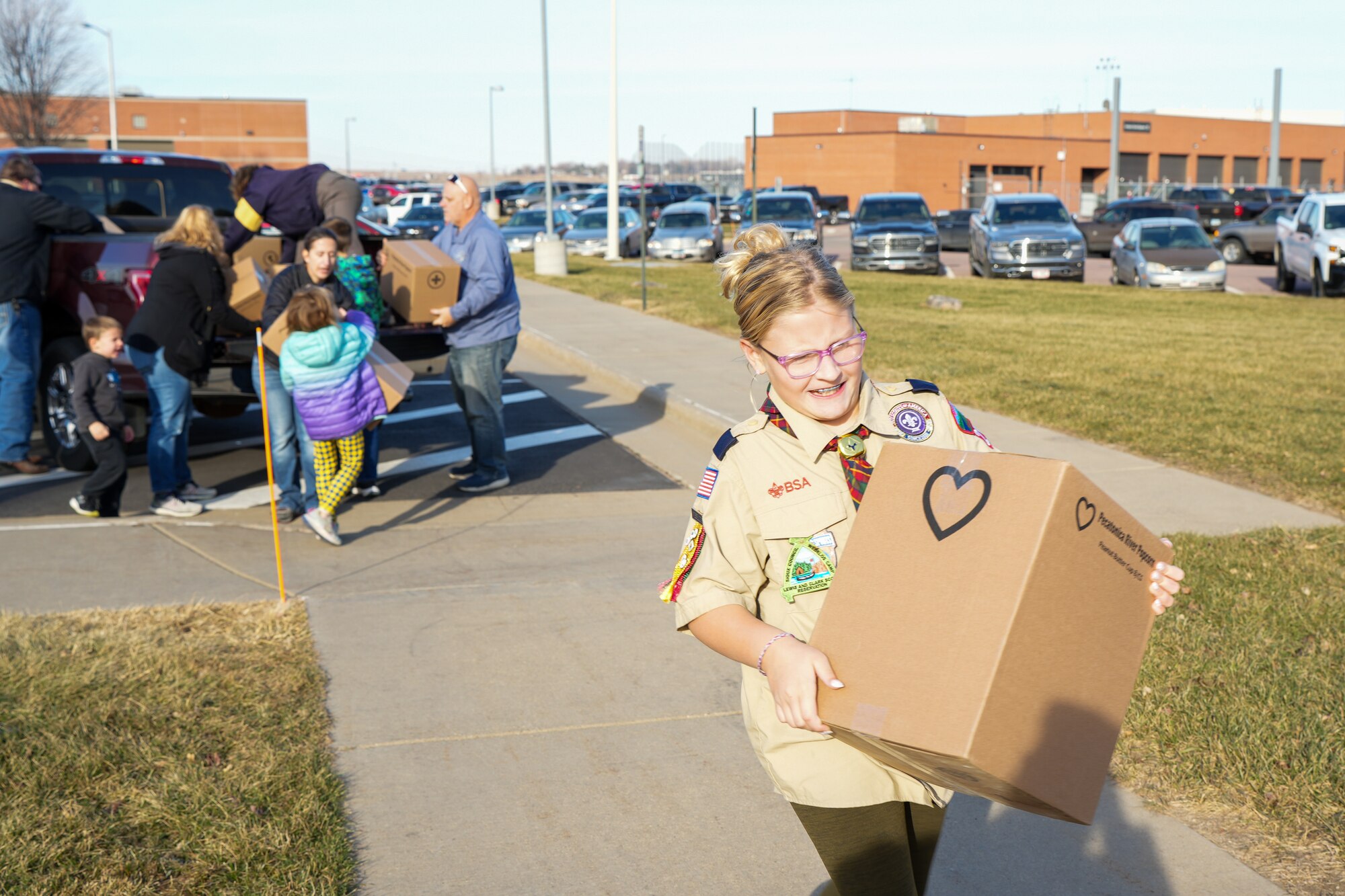 Boy Scouts of America Sioux Council Pack 208 bring popcorn to members of the South Dakota Air National Guard during December's unit training assembly, marking the launch of a partnership between the two organizations, December 2, 2023.