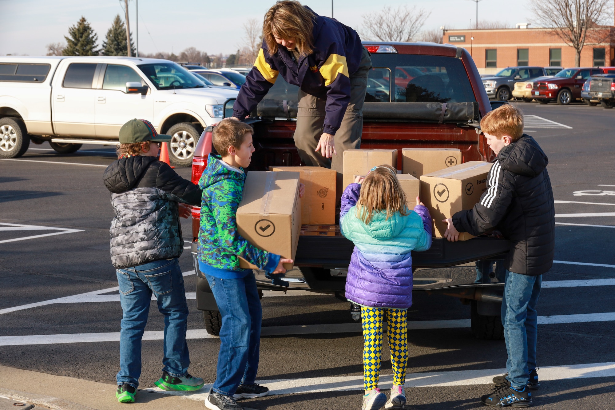 Boy Scouts of America Sioux Council Pack 208 bring popcorn to members of the South Dakota Air National Guard during December's unit training assembly, marking the launch of a partnership between the two organizations, December 2, 2023.